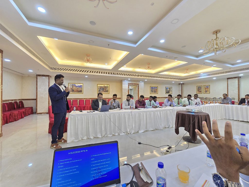 A. Amuthan delivering a talk